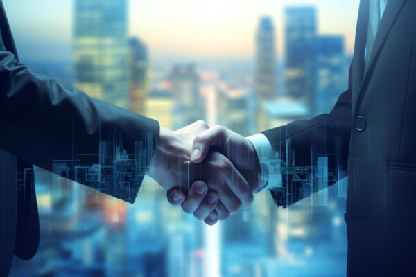 Two businessmen sealing a deal with a handshake, skyscrapers towering in the background. LCS Qatar plays a vital role in facilitating international business partnerships."